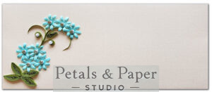 Handcrafted light blue floral envelope with quilled green leaves on premium textured cardstock, perfect for gifting, invitations, and special occasions.