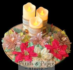 Christmas LED flameless candle centerpiece with red and gold poinsettias, glittering foliage, and festive accents on a decorative plate, perfect for holiday décor and gifting.