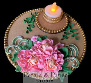 Handcrafted pink rose tea light holder plate with green leaves, quilled designs, gold bead edging, and an ornate gold tea light holder for festive home décor.