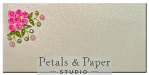 Handcrafted 7 x 3.5-inch pearl-textured envelope featuring pink quilled roses, green leaves, and gem accents, perfect for gifting money, gift cards, or notes for weddings and special occasions.