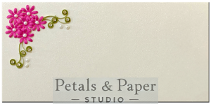 Handmade envelope with pink quilled flowers, green leaves, and pearl embellishments, perfect for weddings, festivals, and gifting cash or cheques.