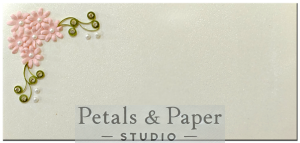 Handmade envelope with pink quilled flowers, green leaves, and pearl embellishments, ideal for weddings, festive gifting, and celebrations.