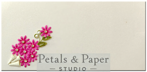 Handmade envelope with a pink floral quilled bouquet, white cone accents, and rhinestone detailing, ideal for weddings, birthdays, and festive gifting.