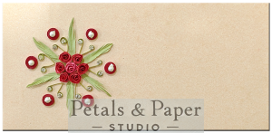 Handmade beige envelope with a red quilled floral mandala, pearl embellishments, and green leaves, perfect for weddings and festive gifting.