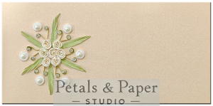 Handmade beige gift envelope with ivory quilled roses, green leaves, pearls, and rhinestone embellishments, perfect for weddings, festive gifting, and special occasions.