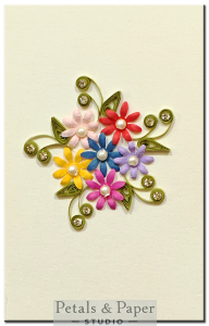 Handmade 5x3 inch greeting card with multicolor floral quilling, pearl embellishments, and rhinestone accents – perfect for birthdays and anniversaries.