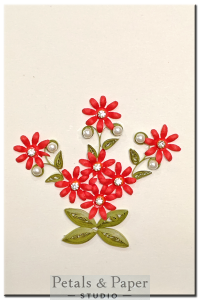Handmade greeting card with red quilled flowers, rhinestones, and pearl accents – perfect for birthdays and special celebrations.