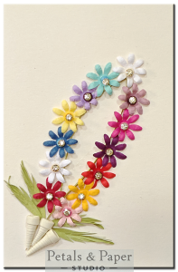 Handmade greeting card with multicolored floral garland and rhinestone accents – perfect for festive occasions, weddings, and colorful celebrations.
