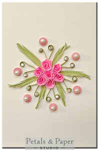 Handmade pink quilled rose greeting card with green leaves, pearls, and rhinestones on cream background – perfect for birthday and celebration gifts.