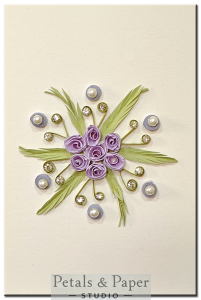 Handmade lavender quilled rose greeting card with green leaves, rhinestones, and pearls on cream background – ideal for birthday or special occasion gifts.