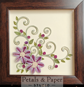 Handcrafted wooden decorative box with purple and white quilled flowers, green vines, and pink buds under transparent lid – jewelry and keepsake storag