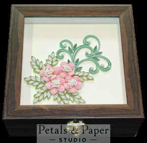Handcrafted wooden decorative box with pink quilled flowers, white centers, green swirling vines, and leaves under transparent lid – jewelry and keepsake storage