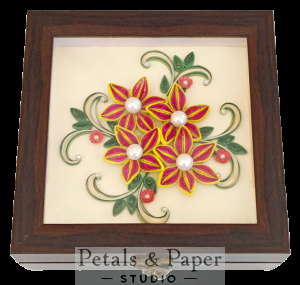 Handcrafted wooden decorative box with magenta and pink quilled flowers outlined in yellow, pearl centers, green leaves, and swirls under transparent lid – jewelry and keepsake storage