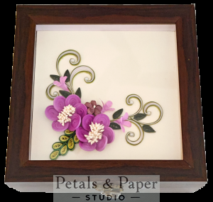 Handcrafted wooden decorative box with purple quilled flowers, pink accents, green leaves, and golden swirls under transparent lid – jewelry and keepsake storage