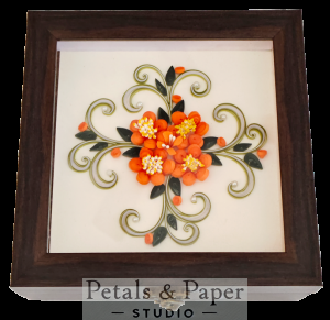 Handcrafted wooden decorative box with orange quilled flowers, yellow-white centers, green leaves, and swirling accents under transparent lid – jewelry and keepsake storage