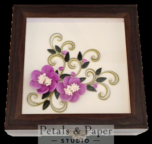 Handcrafted wooden decorative box with purple quilled flowers, pink accents, green leaves, and green white swirls under transparent lid – jewelry and keepsake storage