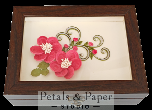 Handcrafted wooden jewelry box with pink quilled paper flowers, white centers, green vines, and glass cover design