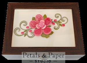Handcrafted wooden jewelry box with pink quilled flower, 3D layered petals, green vines, and glass cover design