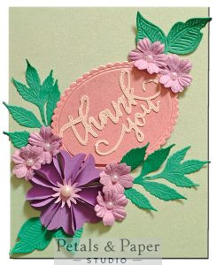 Handmade thank you card with layered purple and lavender paper flowers, green leaf accents and pearl embellishments