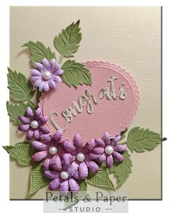Handmade congrats greeting card with 3D purple paper flowers, pearl accents and botanical leaves on blush pink background