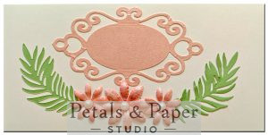 Handcrafted quilled envelope with ornate oval frame, peach paper flowers, green leaf accents and pearl embellishments – luxury handmade gift envelope for weddings and special occasions